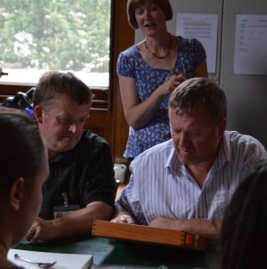 John and Stuart examine a Treasure find with Helen Geake, PASt Explorers Project Officer