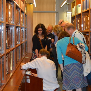 Sam Moorhead, National Finds Adviser, shows volunteers the reference collection of Roman coins in the department of Coins and Medals