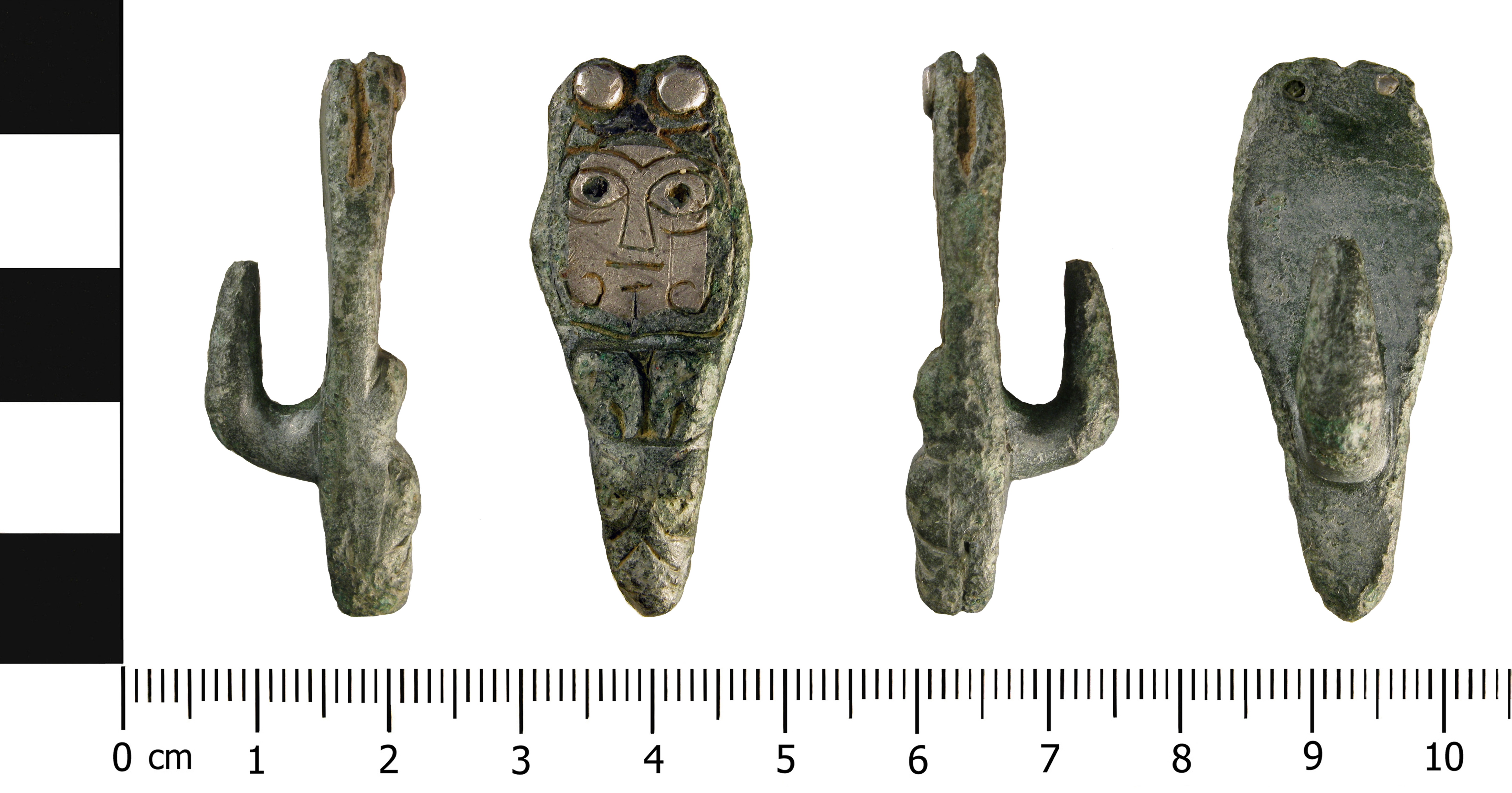 An Early medieval zoomorphic copper alloy strap end with a silver rivet, and a hook attachment on the reverse.