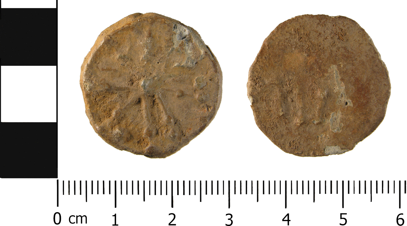 WMID-F94A6C, a bifaced lead token.