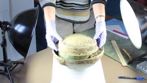 Wiltshire PAS volunteer examining a Roman vessel hoard from Pewsey