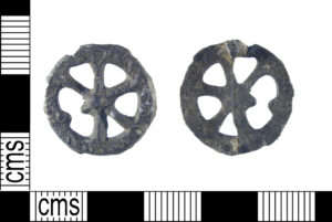 Late medieval pilgrim badge in the shape of a Catherine Wheel.