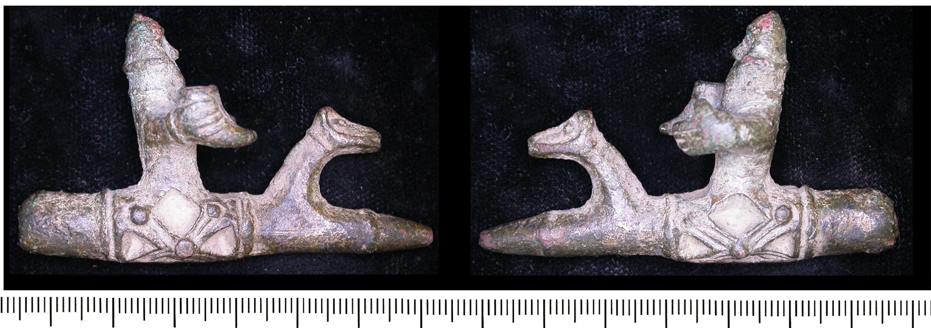 Curious object showing a helmeted Viking holding a drinking horn (LEIC-EEF651)