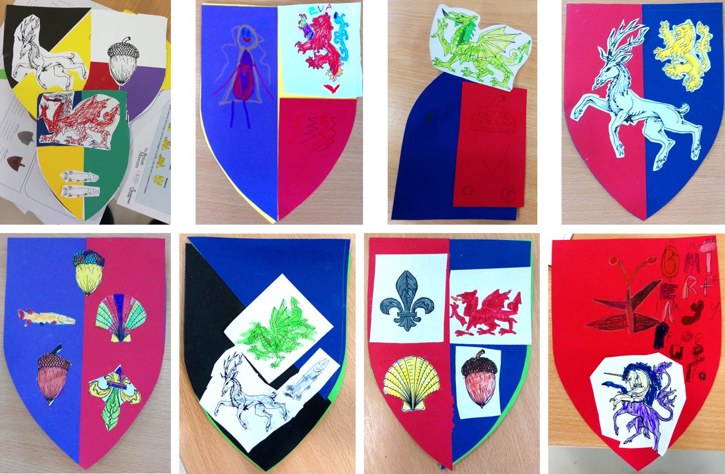 Eight brightly coloured paper shields arranged in two rows of four, one above the other. Each shield has the image of a plant or animal on it.